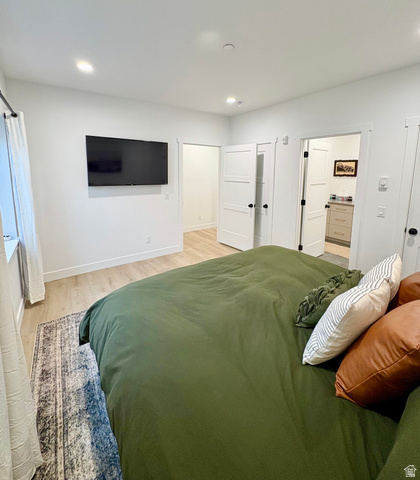 70 East Hwy 153, Unit A4 Beaver, UT 84713 - Photo 9 of 19 Bedroom featuring light wood-style flooring, ensuite bathroom, and recessed lighting