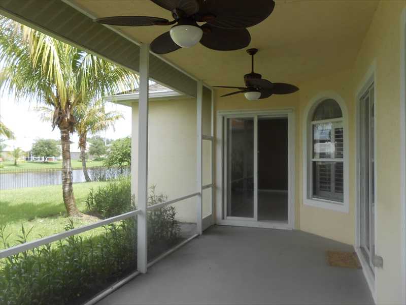 383 West Key Lime Square Southwest Vero Beach, FL 32968 - Photo 16 of 19 a front view of a house with a porch