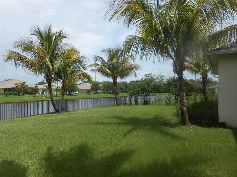 383 West Key Lime Square Southwest Vero Beach, FL 32968 - Photo 19 of 19 a view of outdoor space with trees
