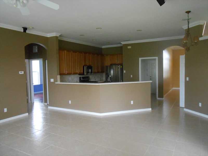 383 West Key Lime Square Southwest Vero Beach, FL 32968 - Photo 6 of 19 a view of a living room and kitchen with furniture