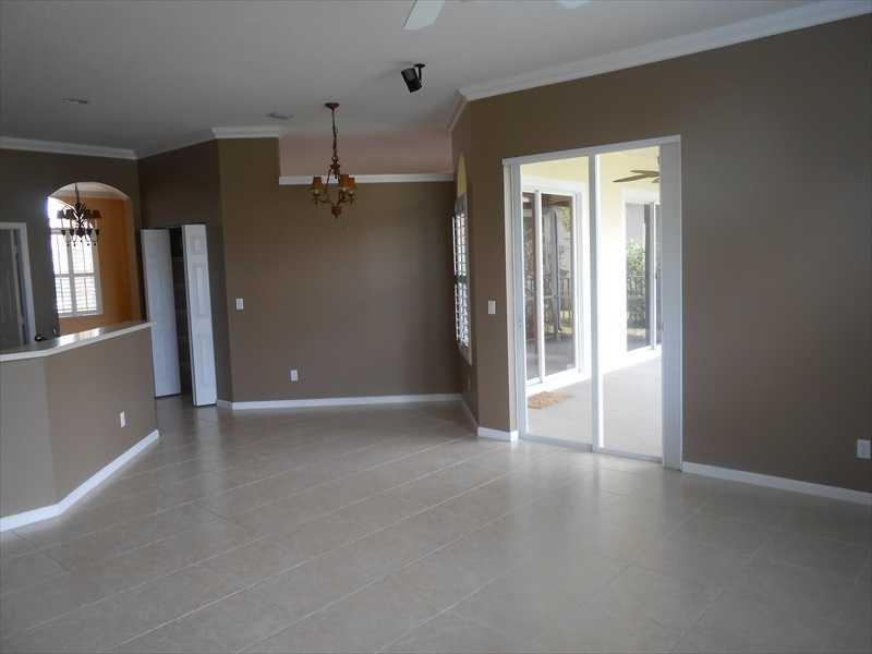 383 West Key Lime Square Southwest Vero Beach, FL 32968 - Photo 8 of 19 wooden floor in a hall with a window
