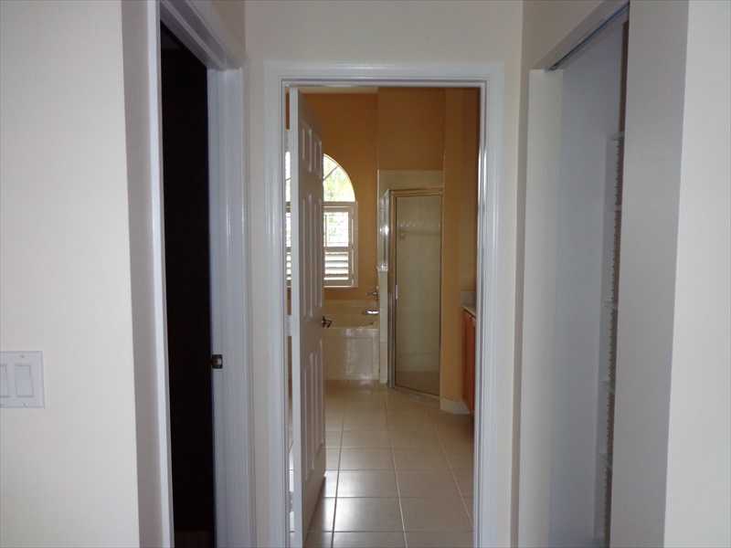 383 West Key Lime Square Southwest Vero Beach, FL 32968 - Photo 10 of 19 a view of a bathroom from a hallway