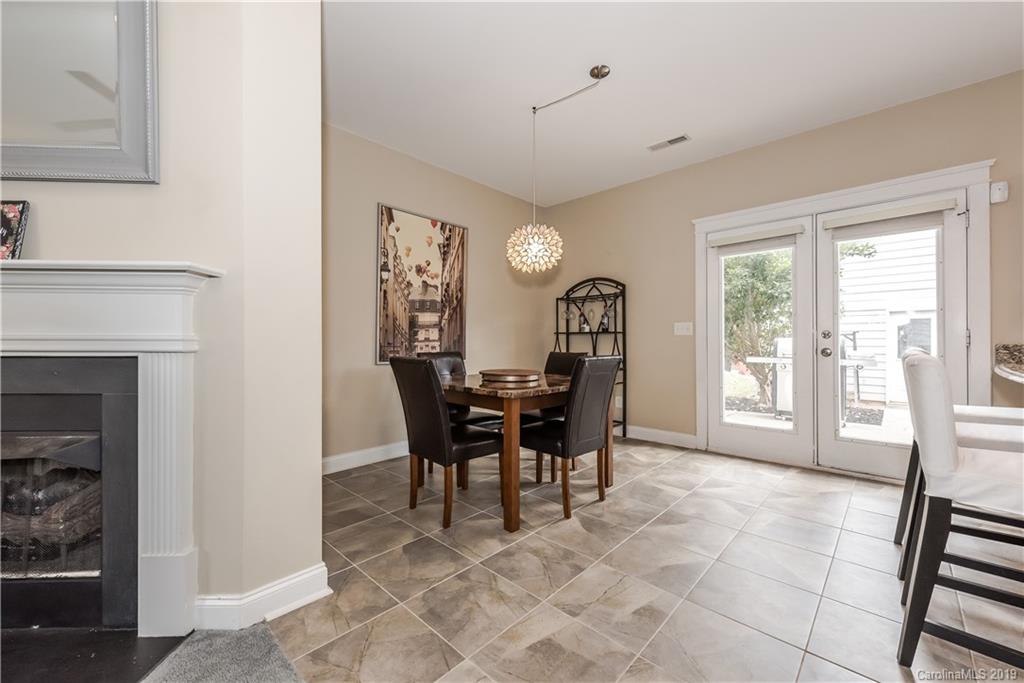 249 Faust Road Davidson, NC 28036 - Photo 12 of 36 a view of a dining room with furniture and a large window