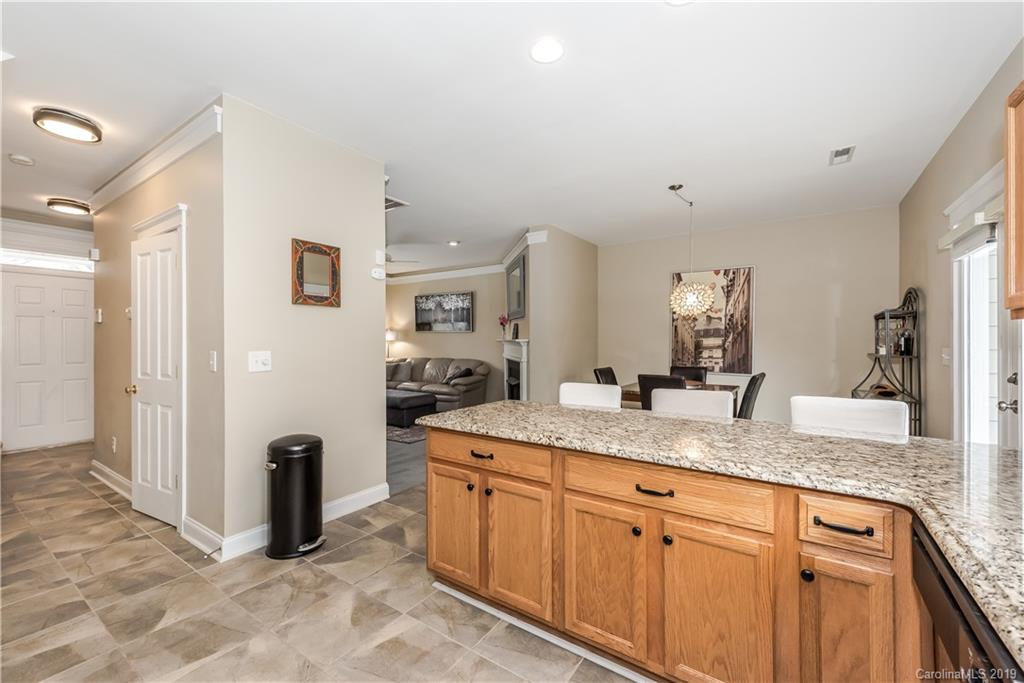 249 Faust Road Davidson, NC 28036 - Photo 20 of 36 a spacious bathroom with a granite countertop sink and a mirror