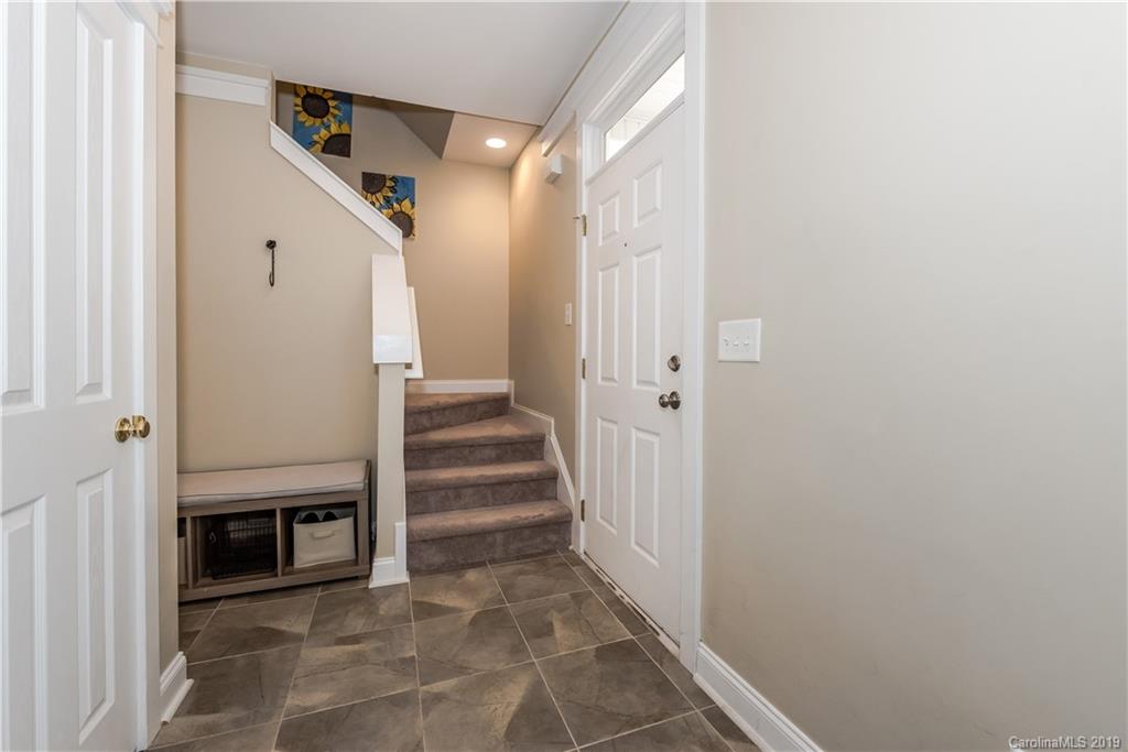 249 Faust Road Davidson, NC 28036 - Photo 3 of 36 a view of a hallway with entryway and stairs