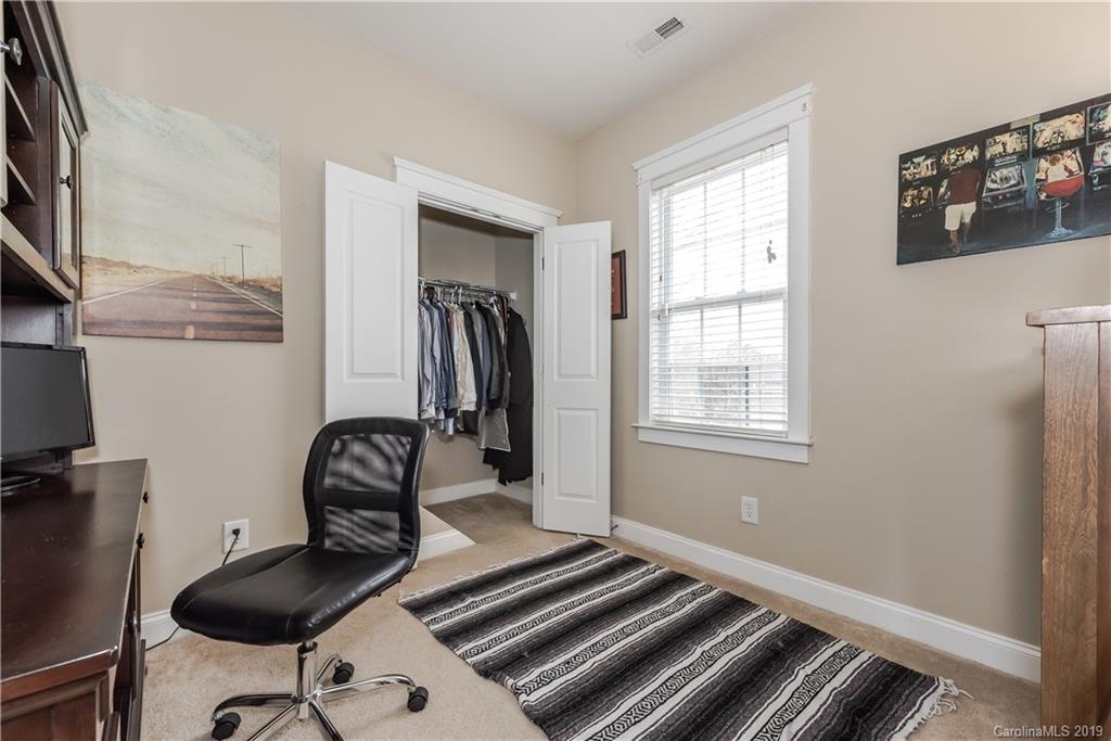 249 Faust Road Davidson, NC 28036 - Photo 21 of 36 a bedroom with furniture and a window