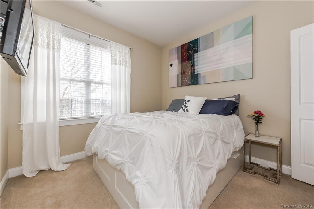 249 Faust Road Davidson, NC 28036 - Photo 25 of 36 a bedroom with a bed and a window