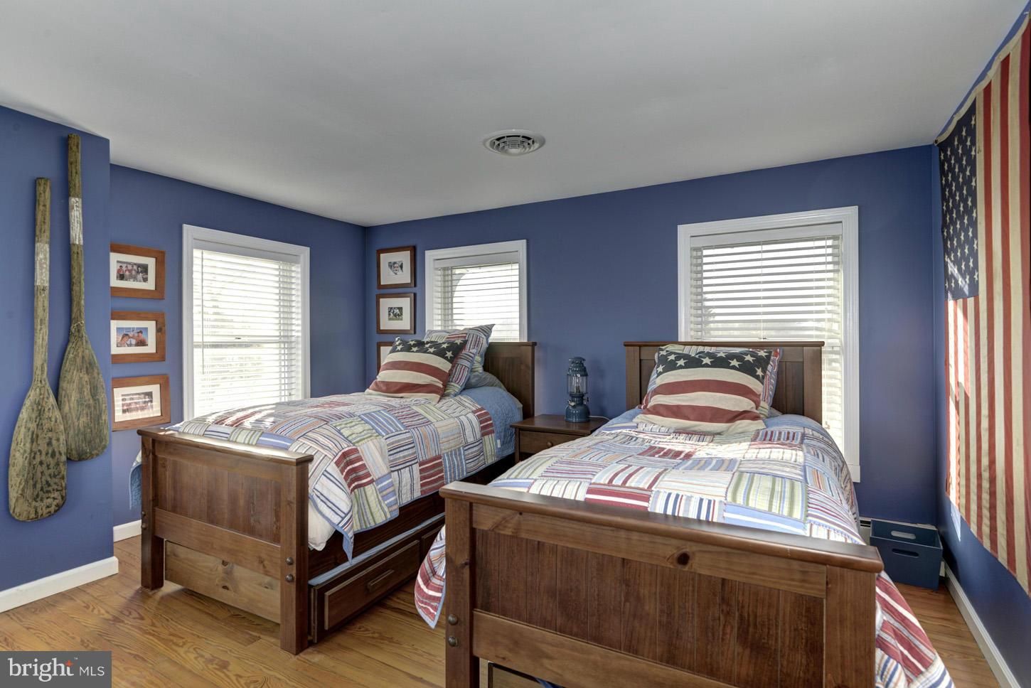 4940 Skinners Neck Road Rock Hall, MD 21661 - Photo 18 of 30 a bedroom with two beds and window