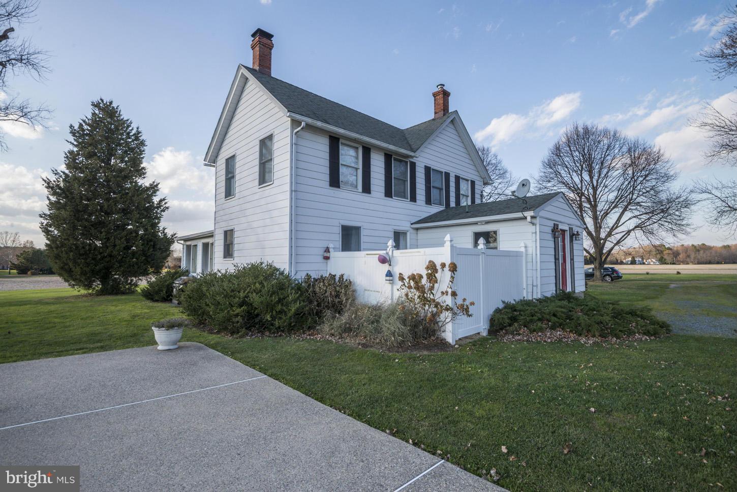 4940 Skinners Neck Road Rock Hall, MD 21661 - Photo 3 of 30 a front view of a house with garden