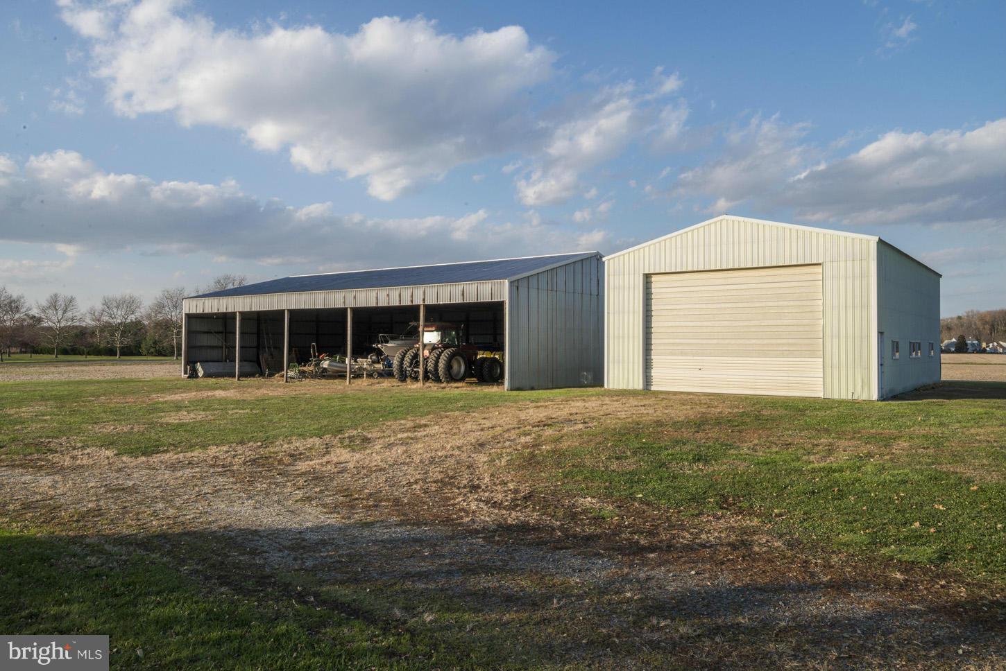 4940 Skinners Neck Road Rock Hall, MD 21661 - Photo 30 of 30 a front view of a house with a garden
