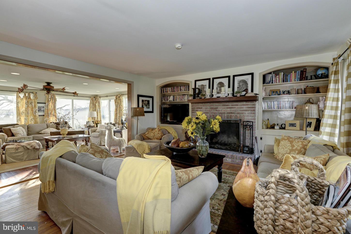 4940 Skinners Neck Road Rock Hall, MD 21661 - Photo 7 of 30 a living room with furniture fireplace and a window