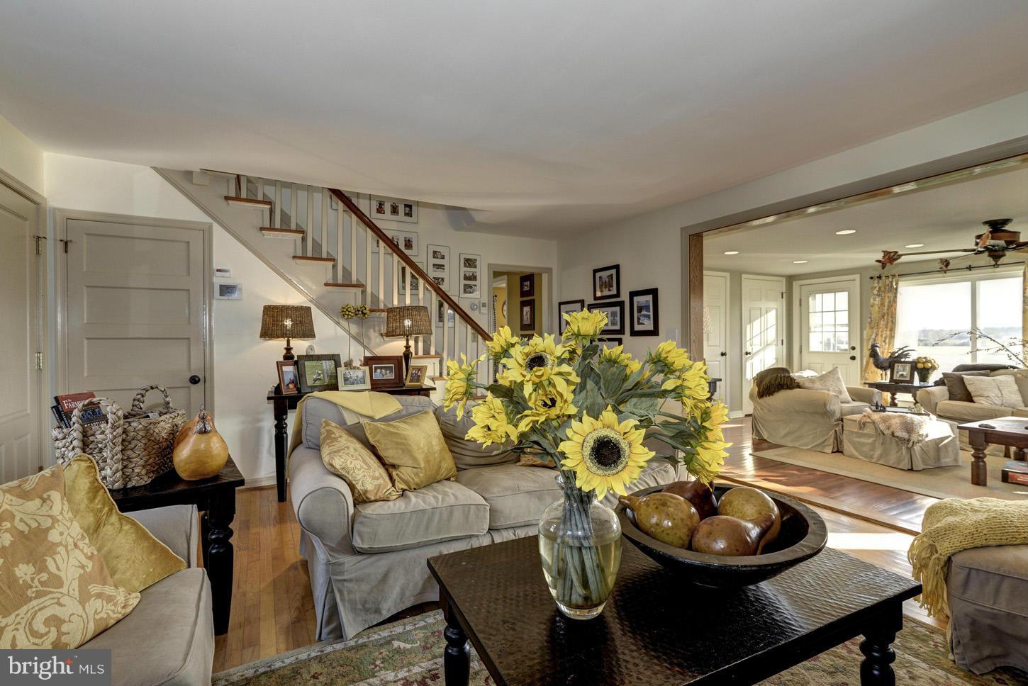 4940 Skinners Neck Road Rock Hall, MD 21661 - Photo 8 of 30 a living room with furniture and a dining table