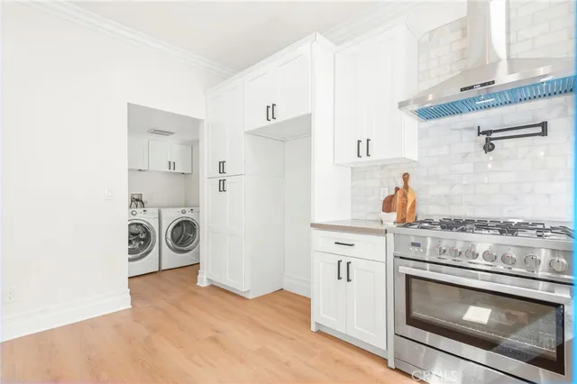 a kitchen with a stove oven and a refrigerator