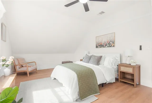 a bedroom with a bed and a chair