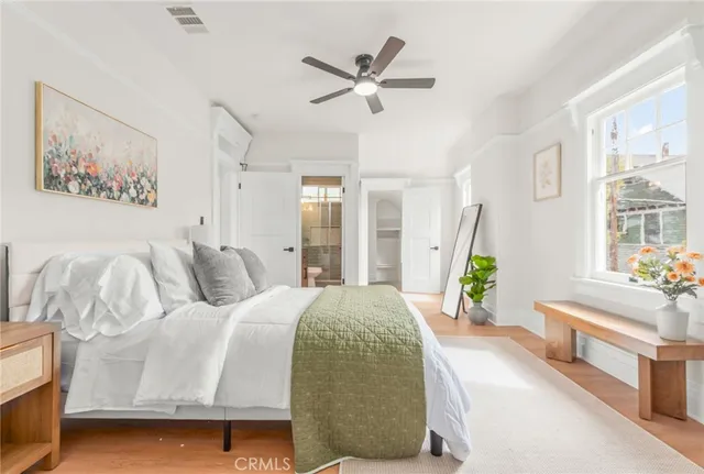 a living room with a bed furniture and a window
