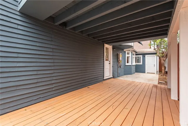 a view of backyard with a wooden deck