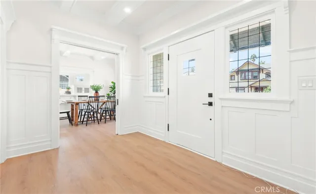 an entryway of livingroom with furniture and wooden floor