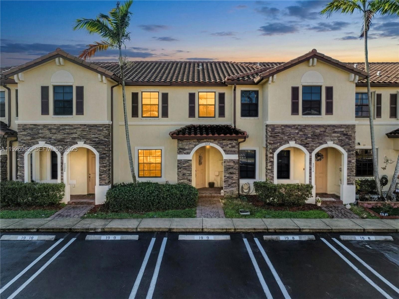 3218 Southeast 5th Court Homestead, FL 33033 - Photo 1 of 68 a front view of a house with yard