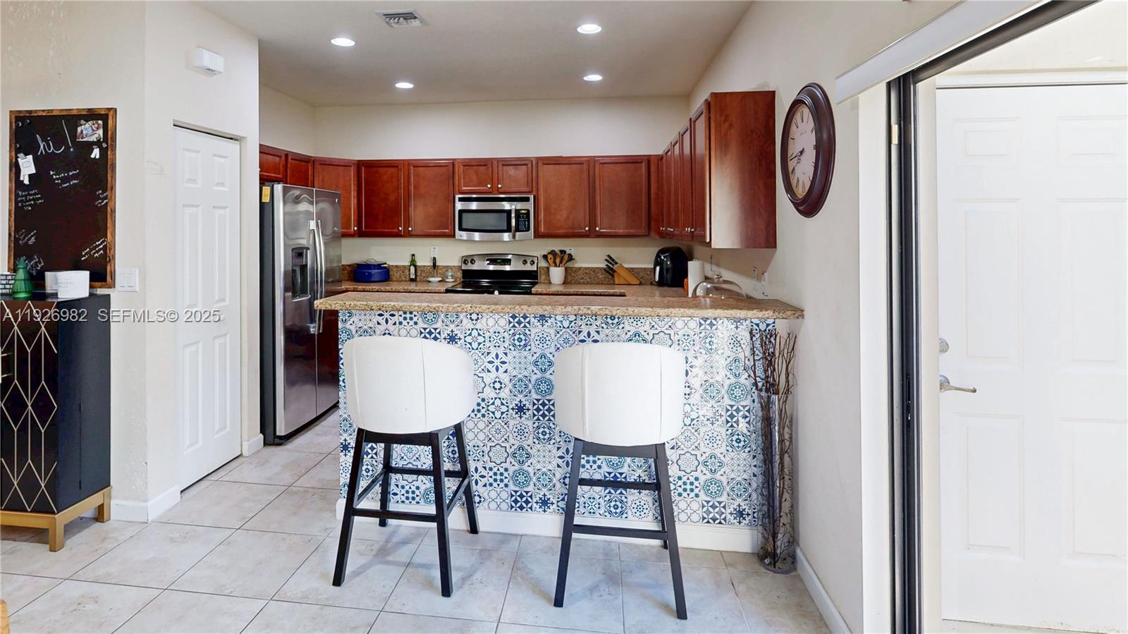 3218 Southeast 5th Court Homestead, FL 33033 - Photo 15 of 68 a large kitchen with a table and chairs in it