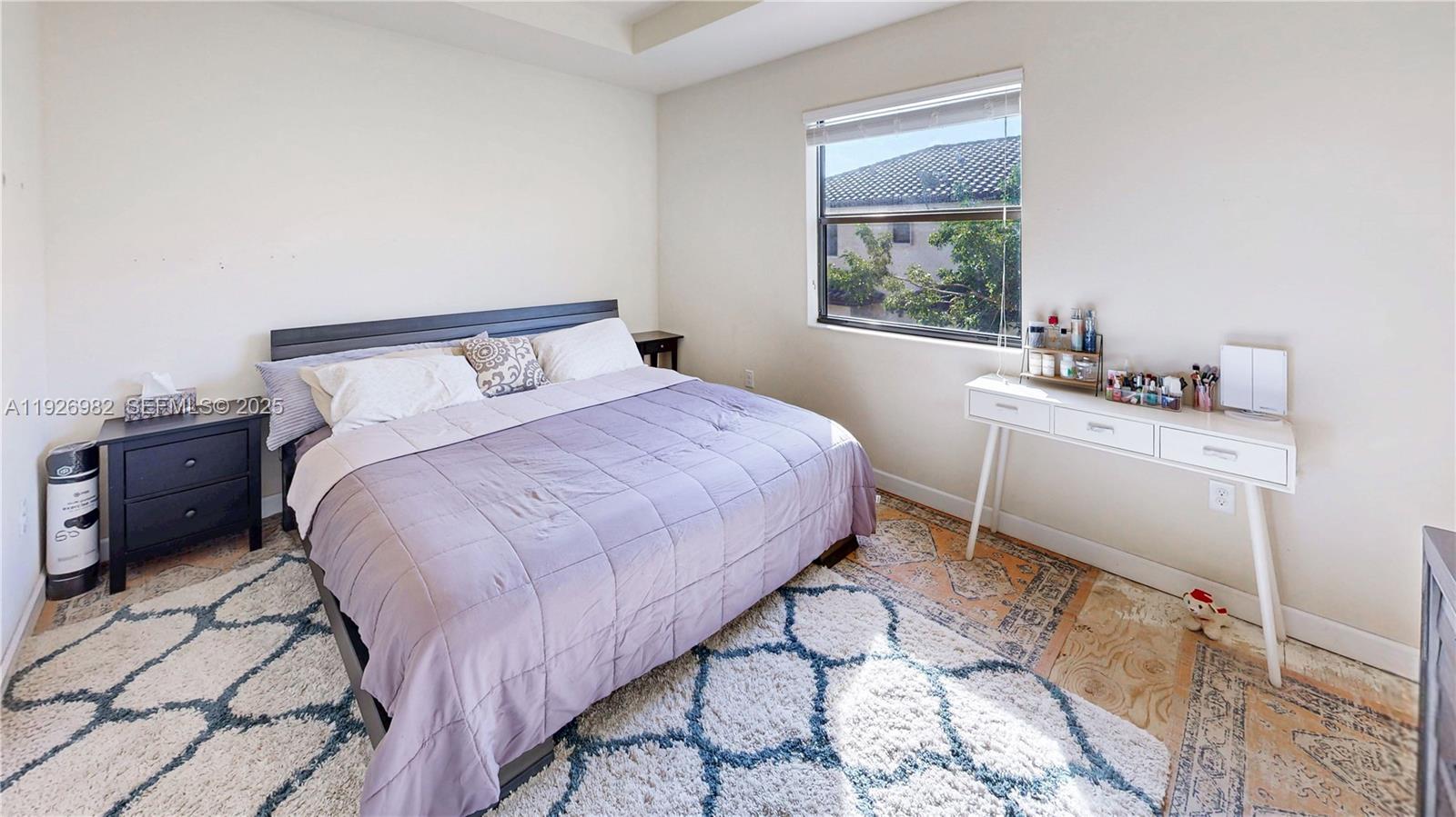 3218 Southeast 5th Court Homestead, FL 33033 - Photo 22 of 68 a bedroom with a bed a dresser a mirror and a window