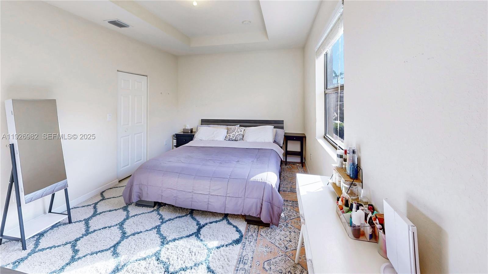 3218 Southeast 5th Court Homestead, FL 33033 - Photo 23 of 68 a bedroom with a bed and a chair