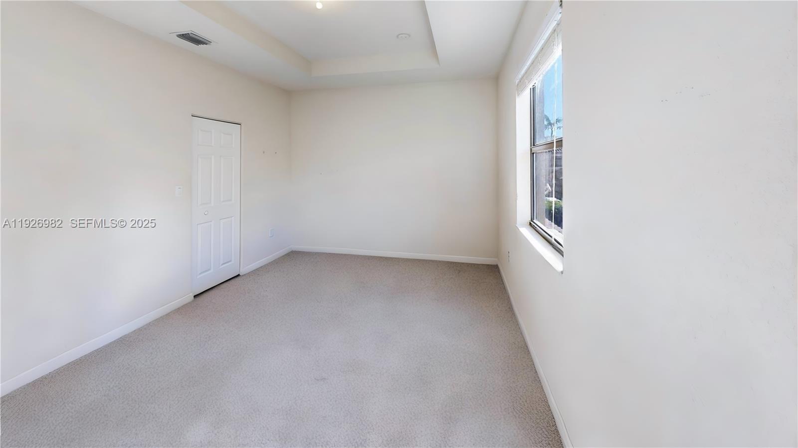 3218 Southeast 5th Court Homestead, FL 33033 - Photo 24 of 68 an empty room with windows