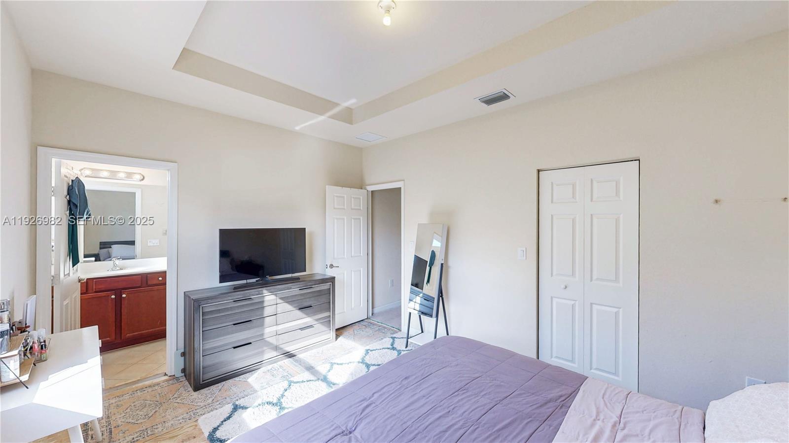 3218 Southeast 5th Court Homestead, FL 33033 - Photo 26 of 68 a view of a livingroom with wooden floor and a flat screen tv