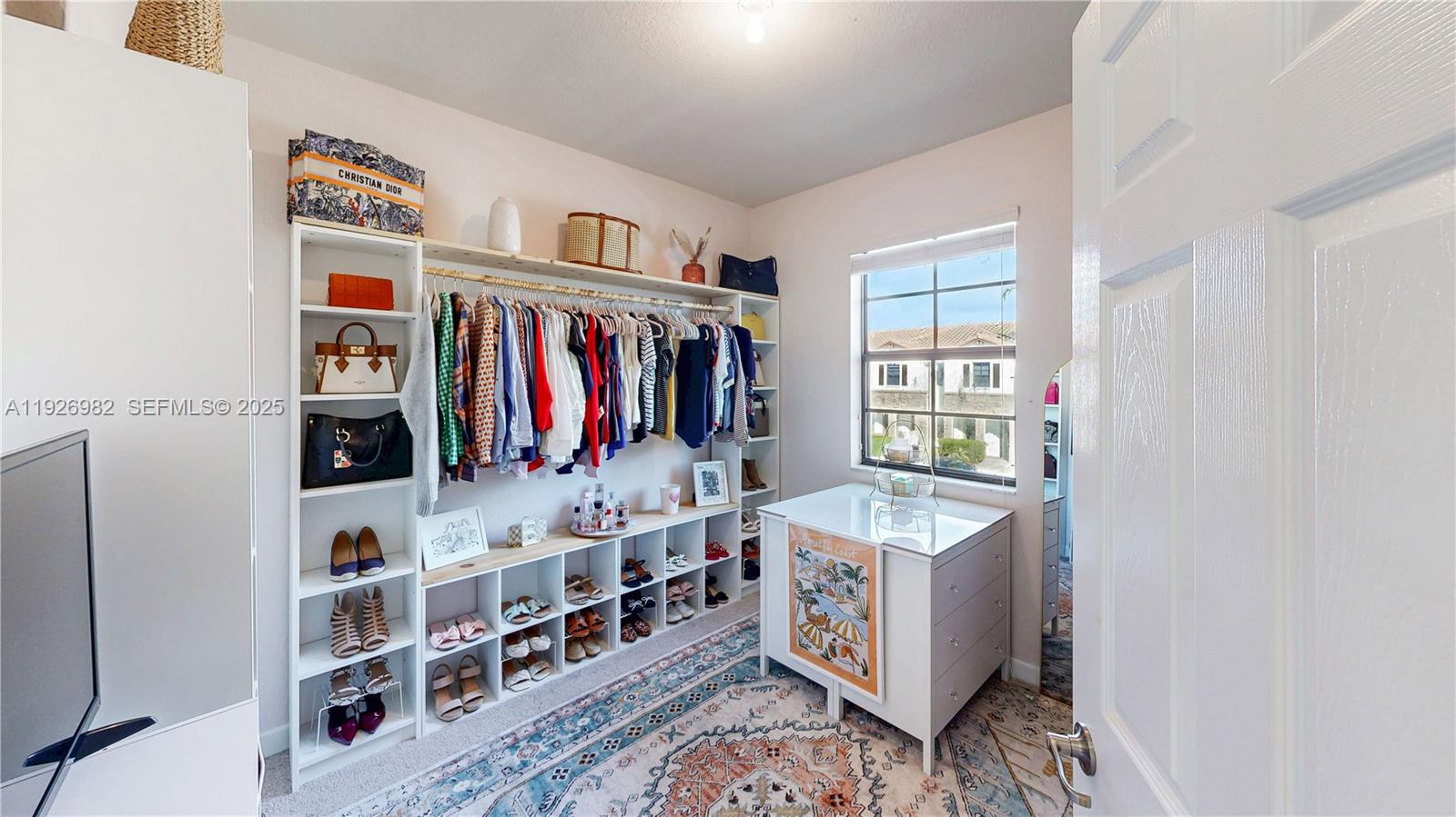 3218 Southeast 5th Court Homestead, FL 33033 - Photo 30 of 68 a bed room with a bed and a book shelf