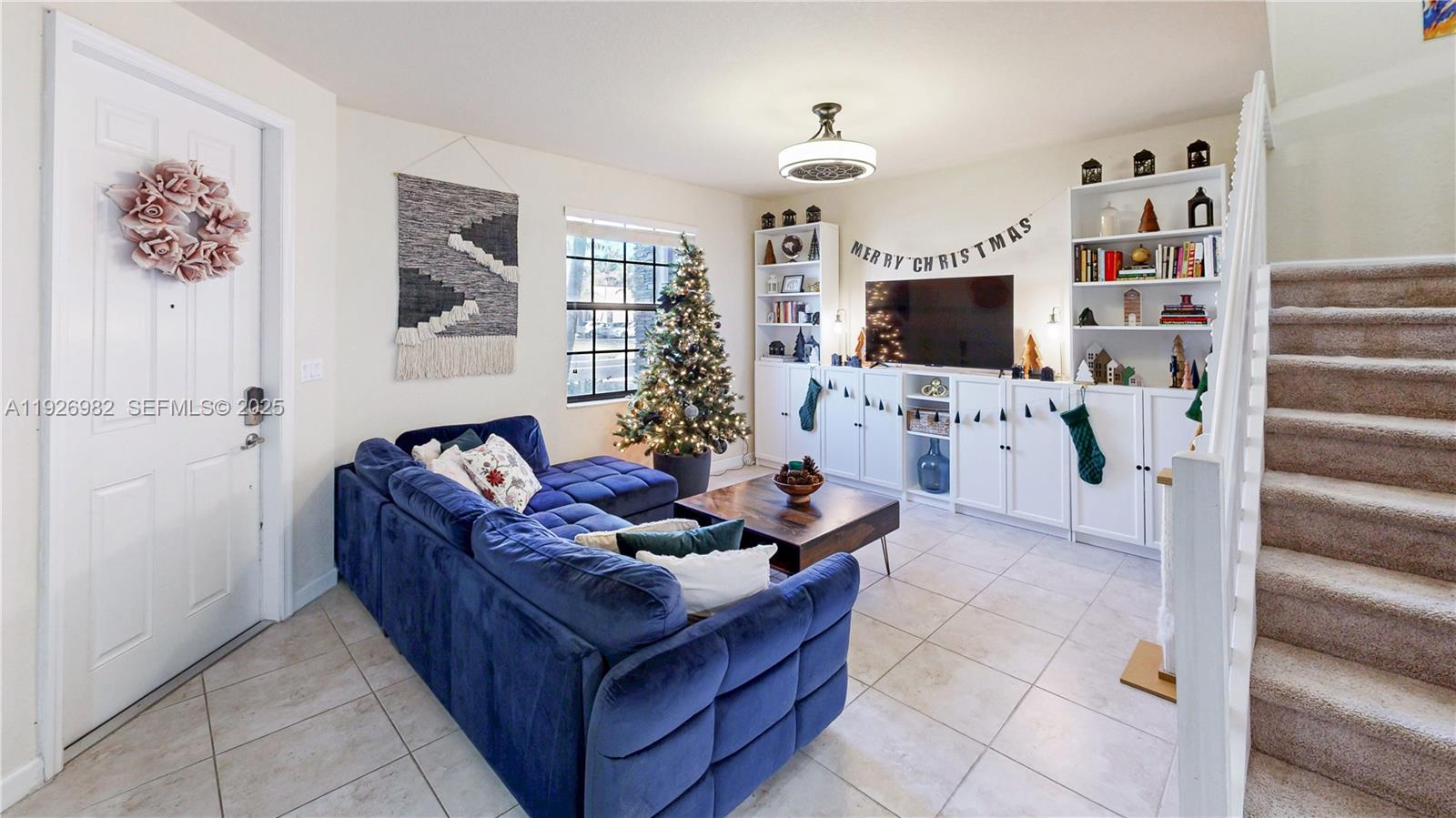 3218 Southeast 5th Court Homestead, FL 33033 - Photo 4 of 68 a living room with furniture and a flat screen tv