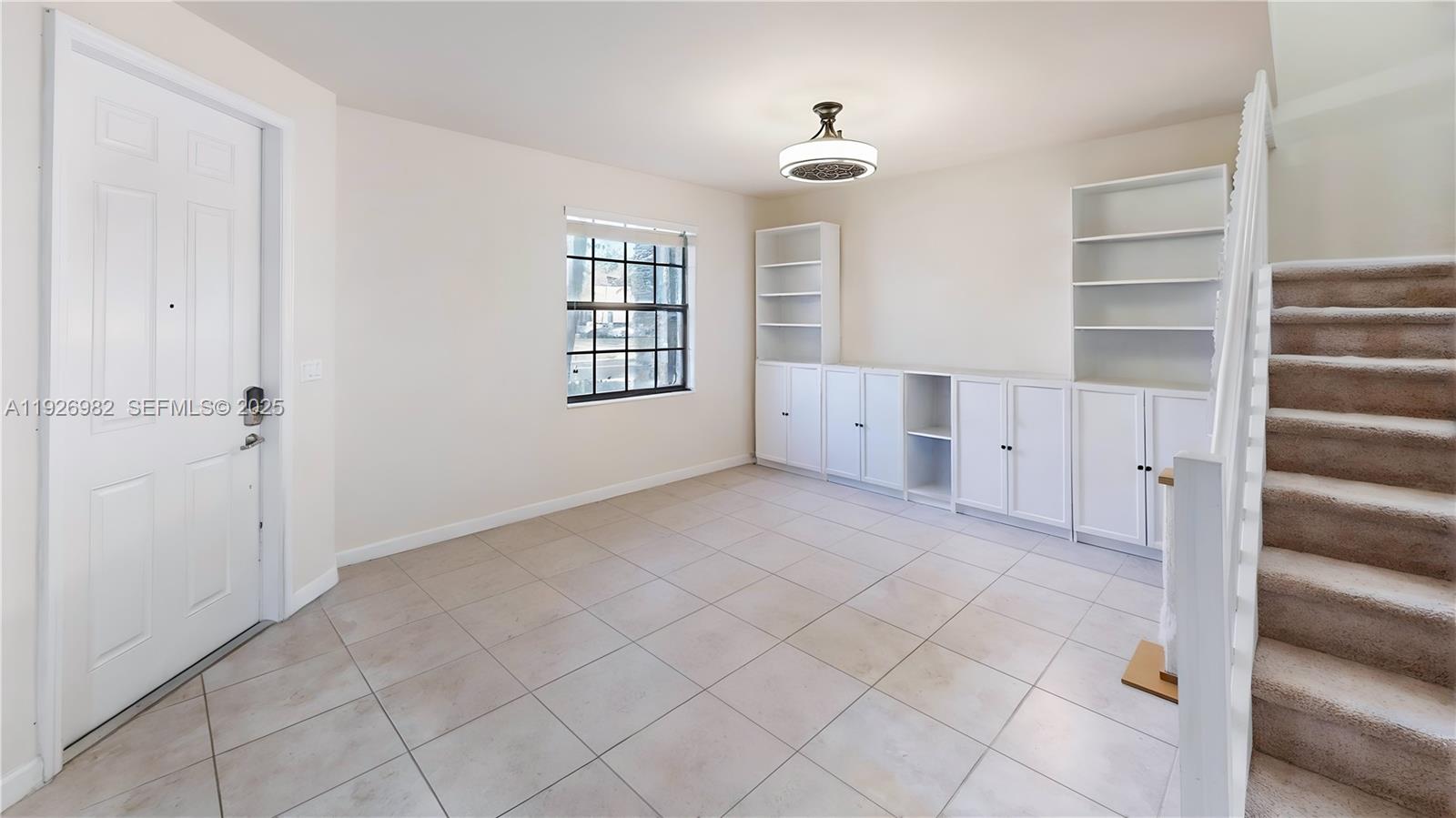 3218 Southeast 5th Court Homestead, FL 33033 - Photo 5 of 68 a view of an empty room with a window