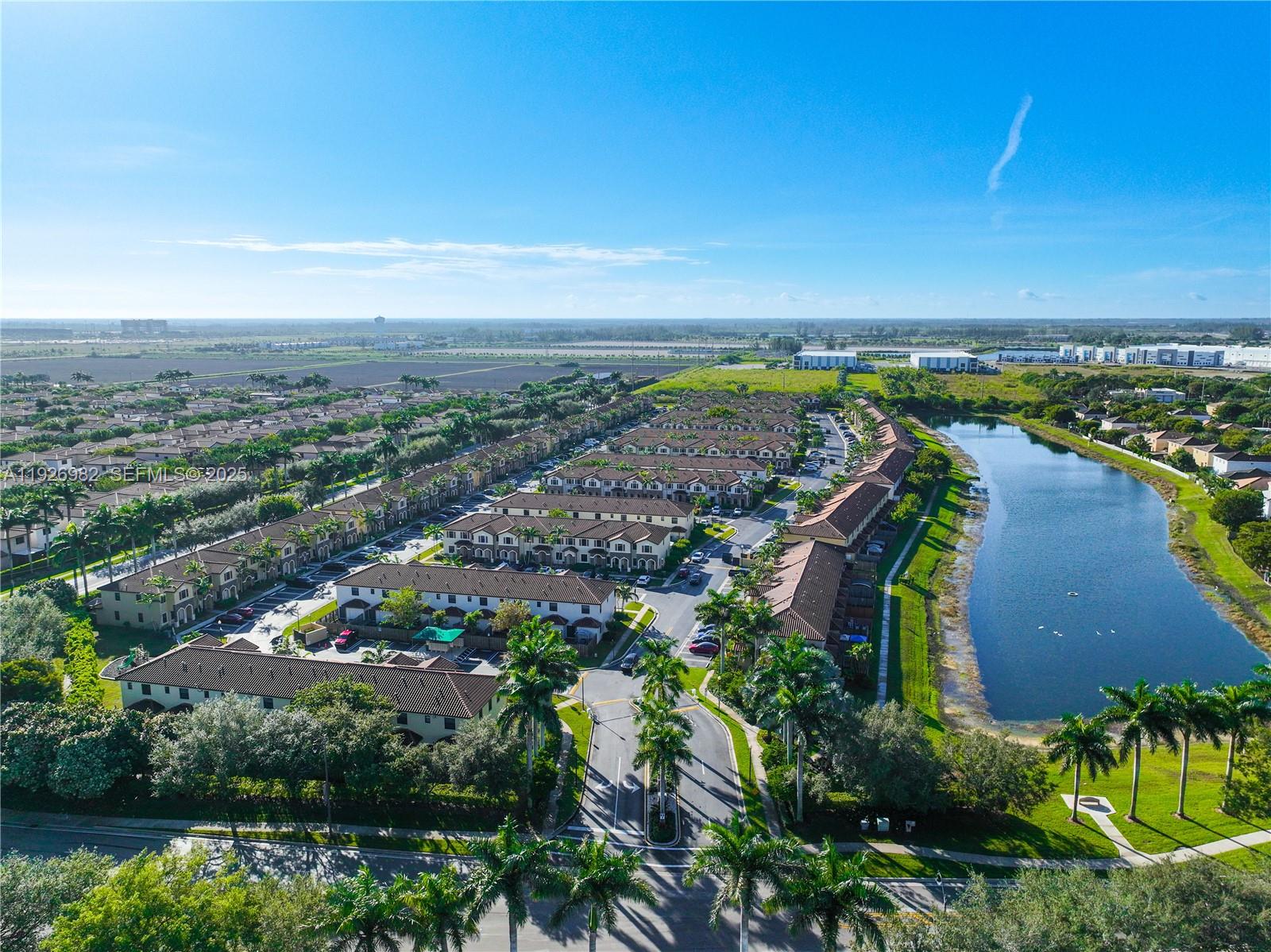 3218 Southeast 5th Court Homestead, FL 33033 - Photo 66 of 68 an aerial view of a city with lots of residential buildings and ocean view