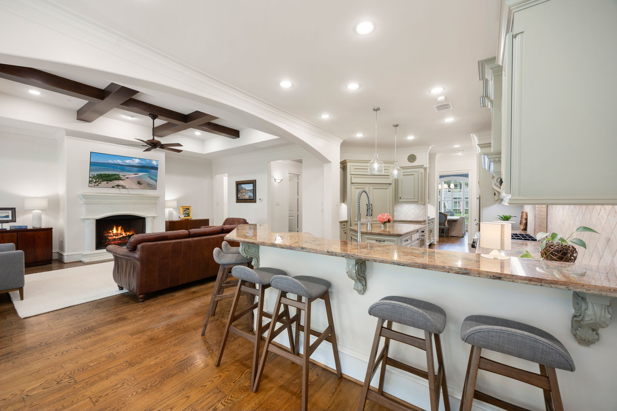 The kitchen is open to the Living room and connects to the formal Dining room.