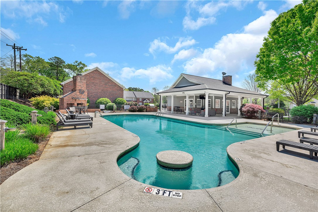 209 Calhoun Street Clemson, SC 29631 - Photo 23 of 25 An inviting swimming pool and spa are paired with a spacious poolside cabana.