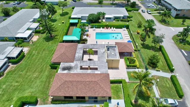 an aerial view of multiple houses with yard