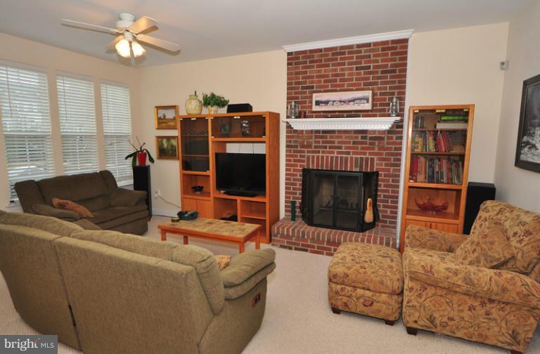 610 Springhouse Square Southeast Leesburg, VA 20175 - Photo 18 of 30 Floor to ceiling brick wood burning fireplace