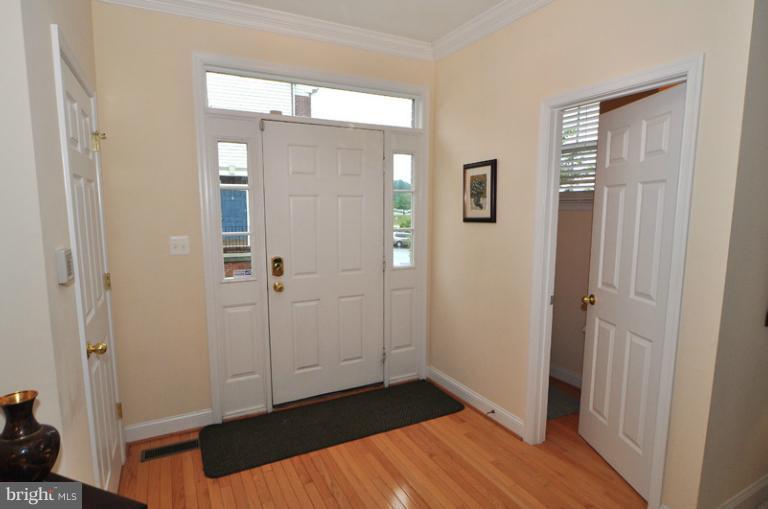 610 Springhouse Square Southeast Leesburg, VA 20175 - Photo 27 of 30 Gleaming hardwood floor in the entry