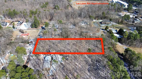 a view of front door of house and flowers