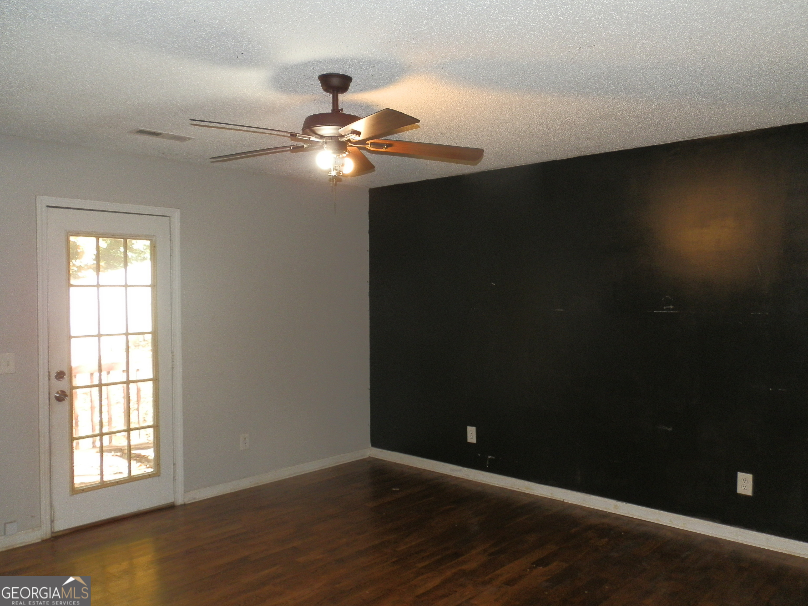 114 Lindsey Court Northeast Calhoun, GA 30701 - Photo 11 of 26 a view of an empty room with wooden floor and a window