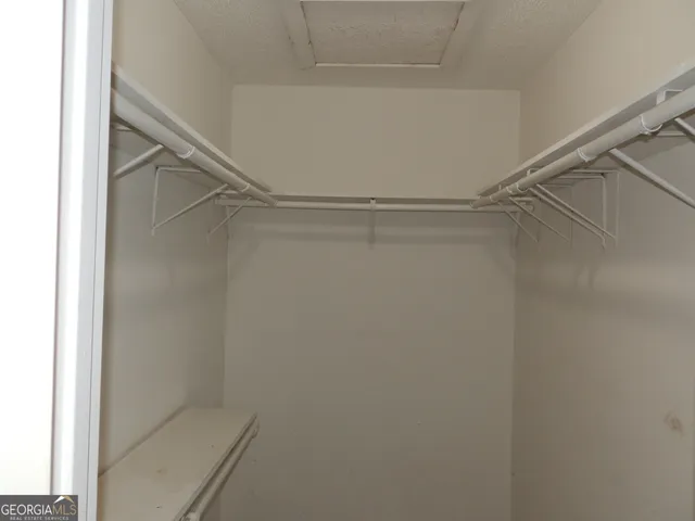 a view of an empty walk in closet