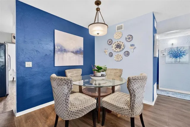 a view of a dining room with furniture