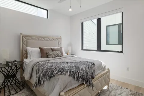 a bedroom with a bed and window