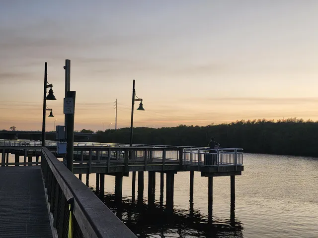 a view of a balcony with wooden floor and ocean view