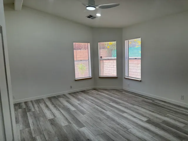 a bathroom with a sink vanity and mirror