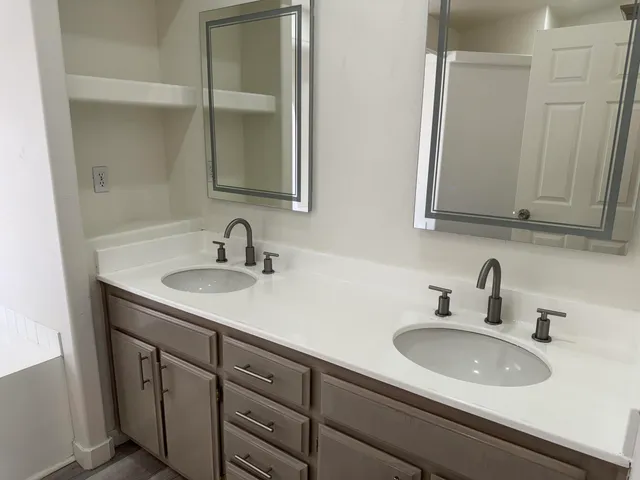 a bathroom with a tub and a mirror