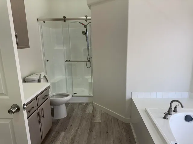 a bathroom with a double vanity sink and mirror