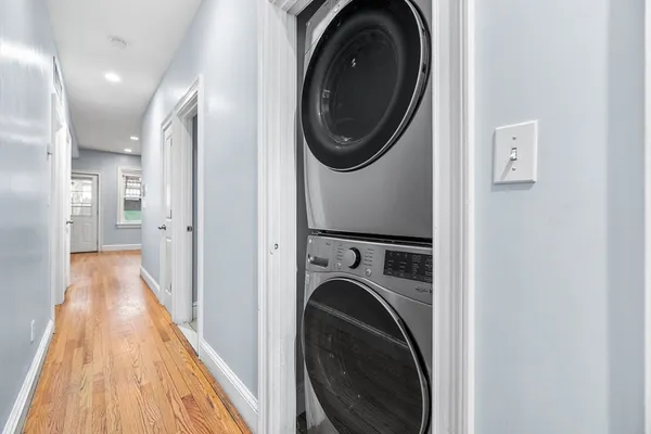 a view of a hallway with washer and dryer