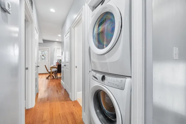 a view of a hallway with washer and dryer