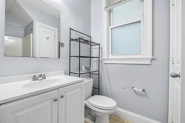 a bathroom with a sink toilet and vanity