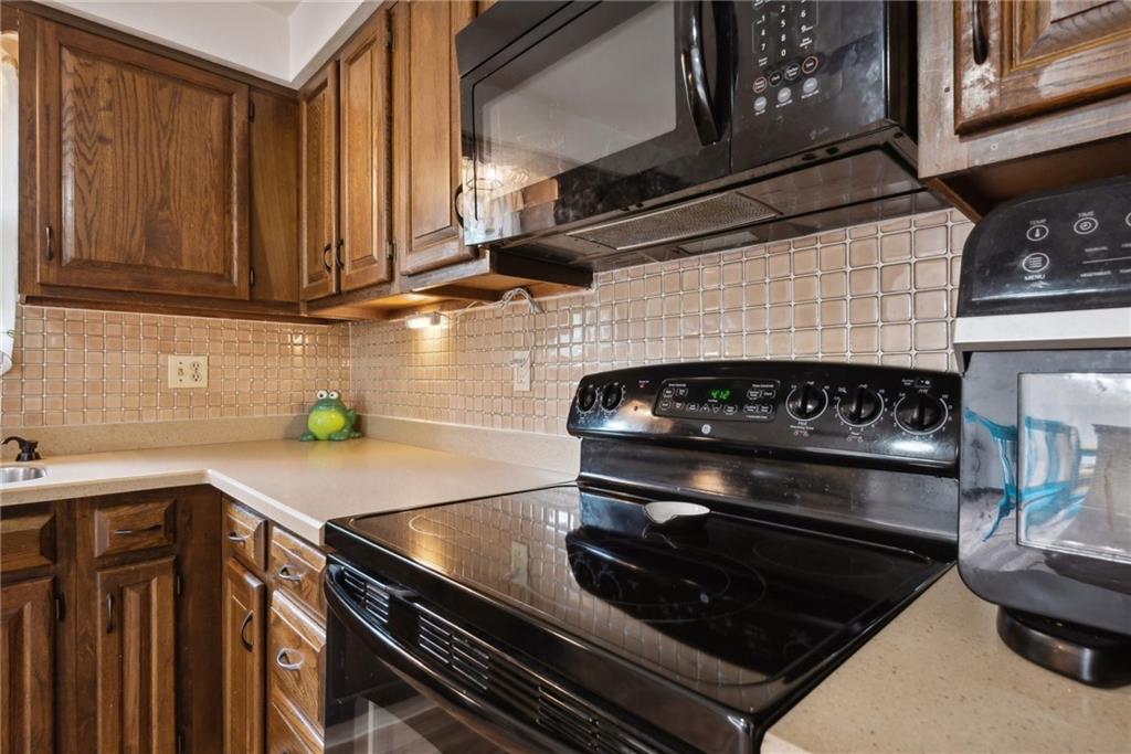 101 Edith Drive Hunker, PA 15639 - Photo 11 of 35 a kitchen with a stove and a microwave