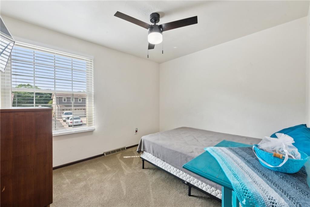 101 Edith Drive Hunker, PA 15639 - Photo 19 of 35 a bedroom with a bed and a window